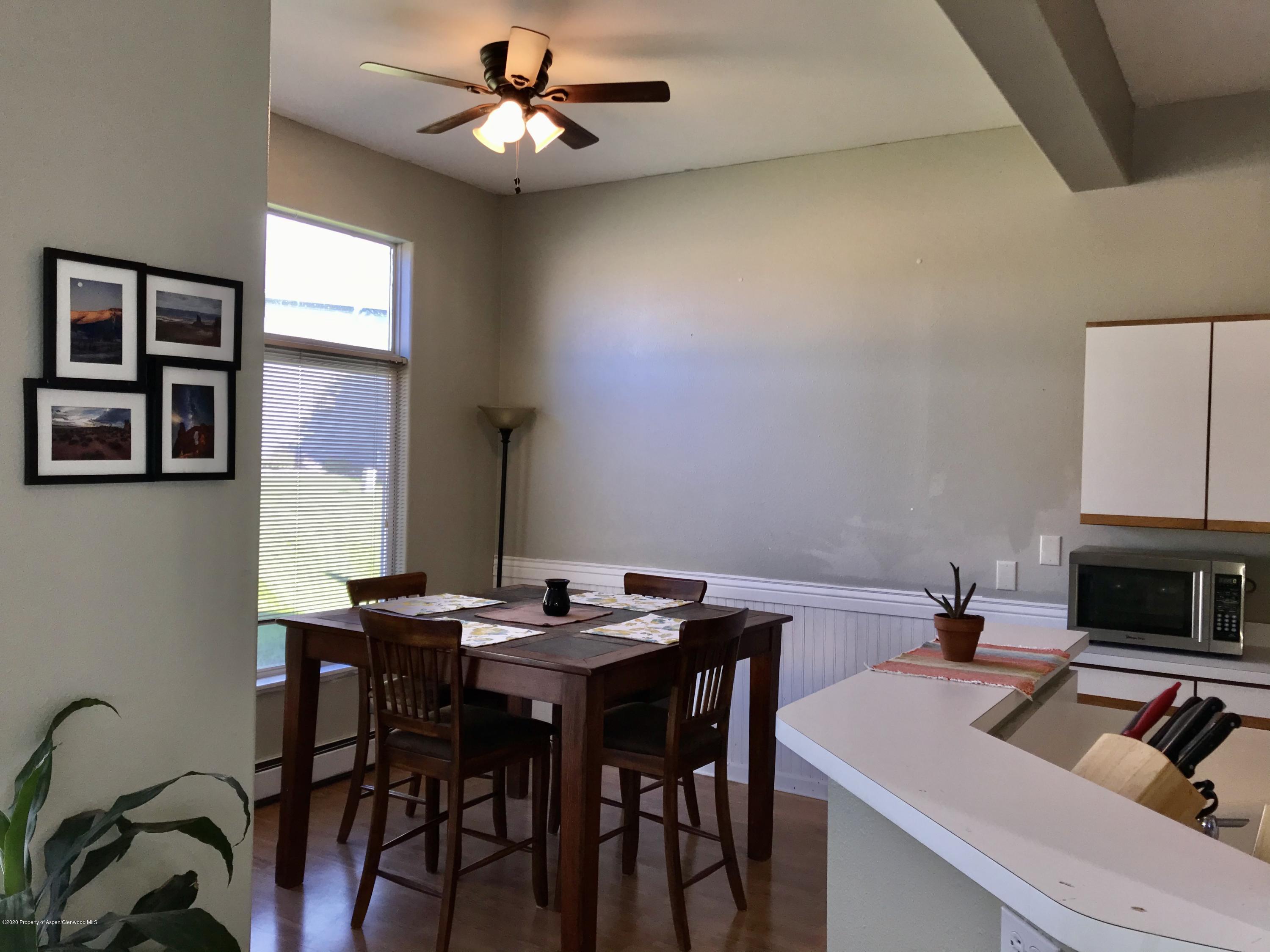 16 Limberpine Circle Parachute, CO 81635 - Photo 7 of 22 a view of a dining room with furniture and a chandelier