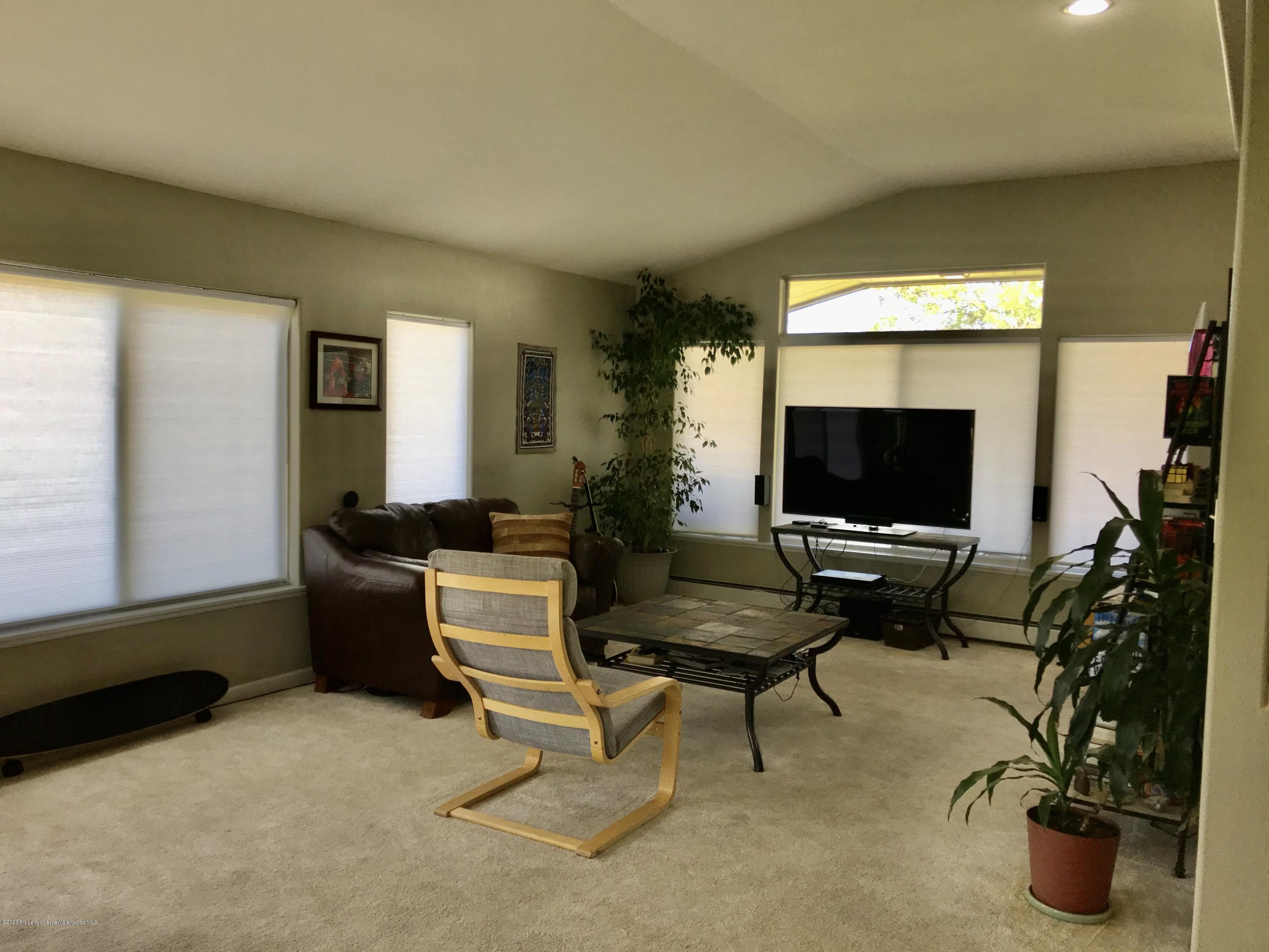 16 Limberpine Circle Parachute, CO 81635 - Photo 9 of 22 a living room with furniture and a flat screen tv