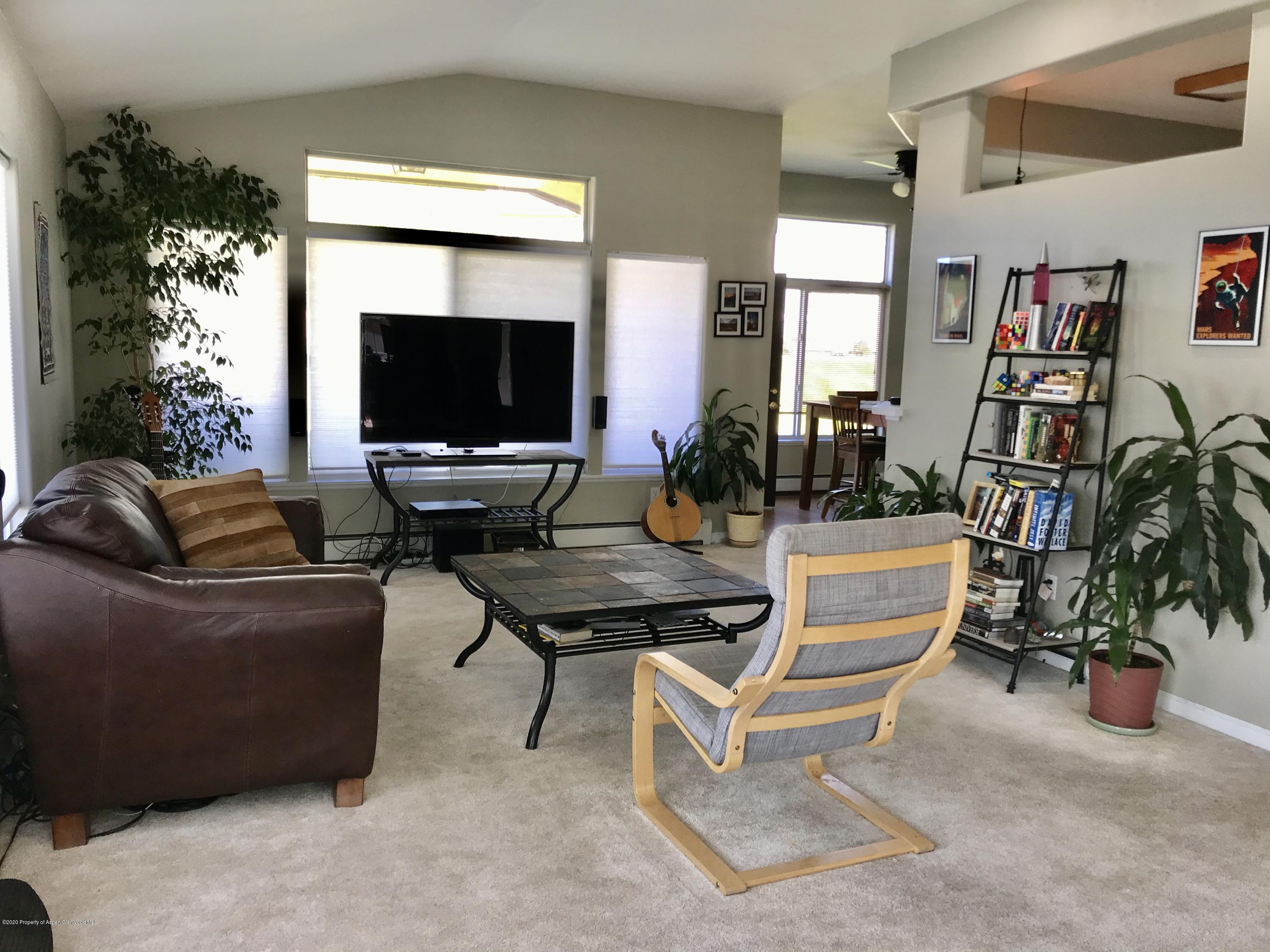 16 Limberpine Circle Parachute, CO 81635 - Photo 10 of 22 a living room with furniture and a flat screen tv
