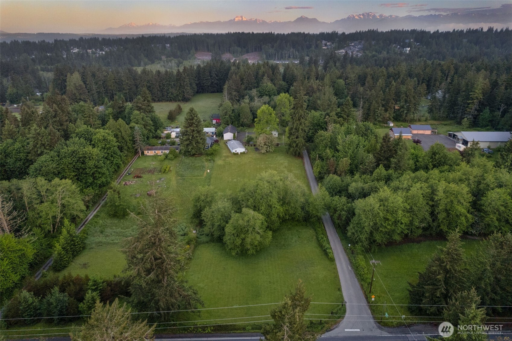 135 Walker Road Northwest Poulsbo, WA 98370 - Photo 15 of 24 a view of a lake with a mountain in the background