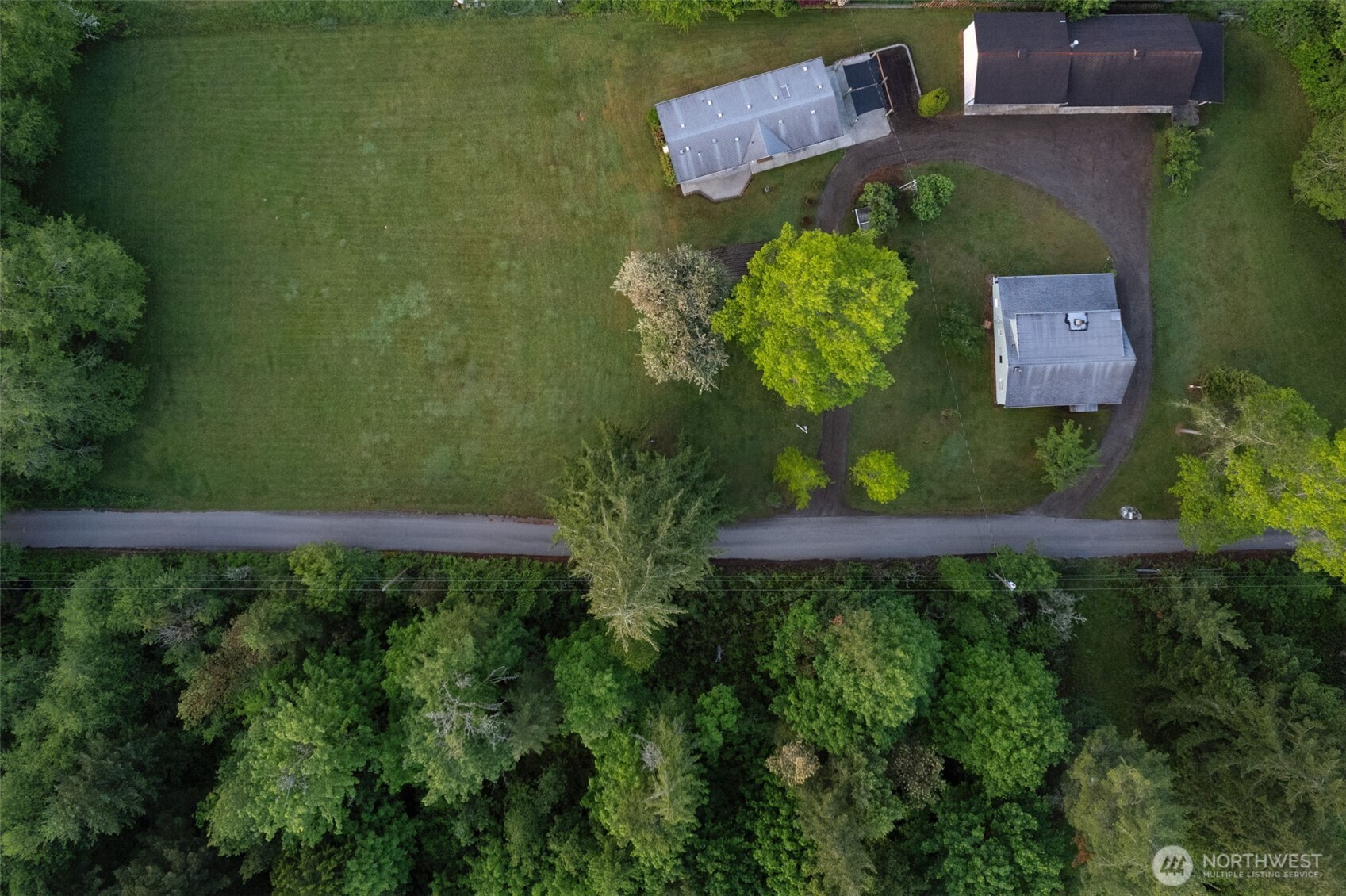 135 Walker Road Northwest Poulsbo, WA 98370 - Photo 17 of 24 an aerial view of a house with a yard basket ball court and outdoor seating