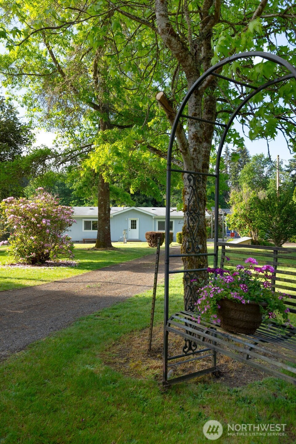 135 Walker Road Northwest Poulsbo, WA 98370 - Photo 22 of 24 a view of a house with a backyard