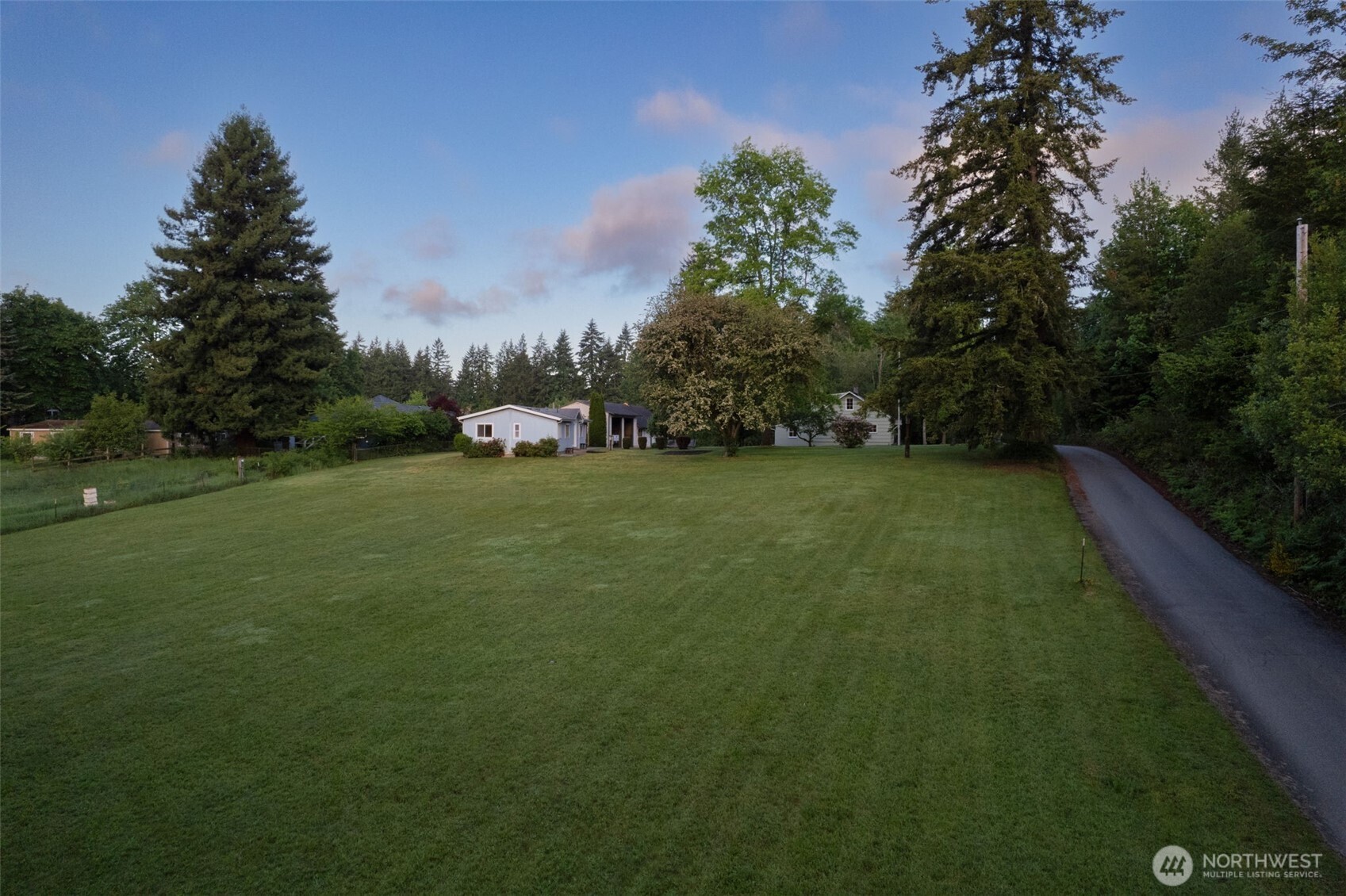 135 Walker Road Northwest Poulsbo, WA 98370 - Photo 3 of 24 a view of a golf course with a garden