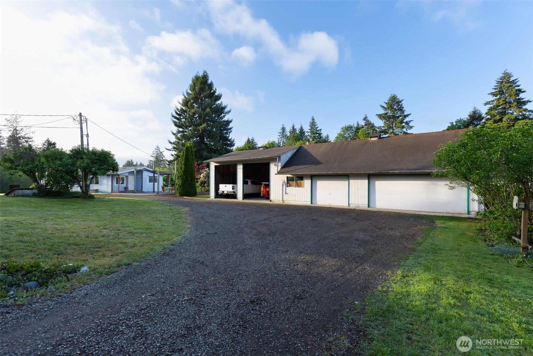 135 Walker Road Northwest Poulsbo, WA 98370 - Photo 4 of 24 a front view of a house with garden