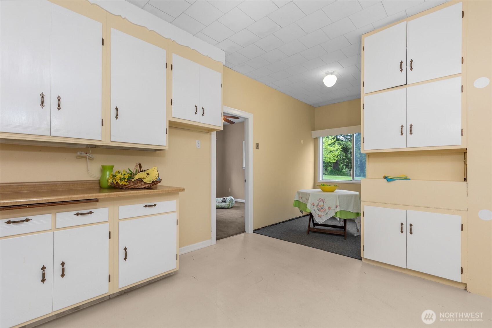 135 Walker Road Northwest Poulsbo, WA 98370 - Photo 8 of 24 a kitchen with cabinets and window