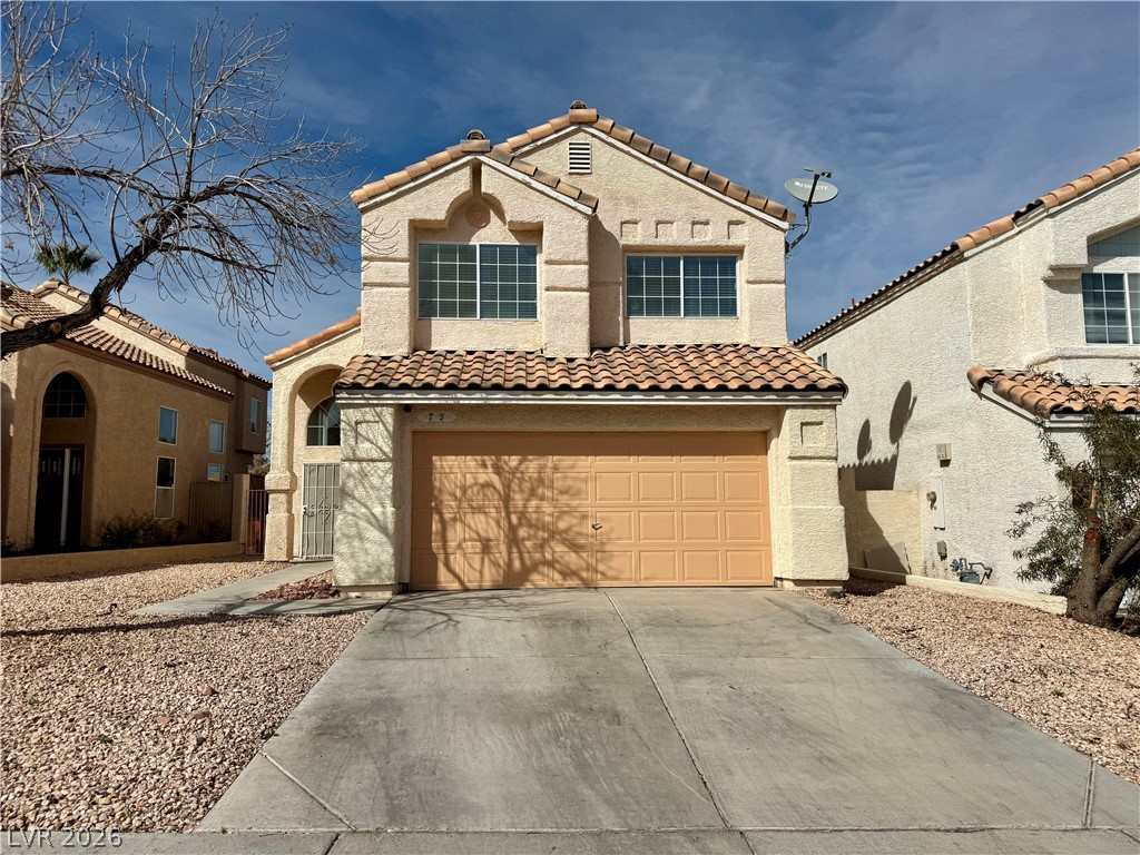 73 Sea Holly Way Henderson, NV 89074 - Photo 1 of 59 Mediterranean / spanish house with concrete driveway, stucco siding, a garage, and a tiled roof