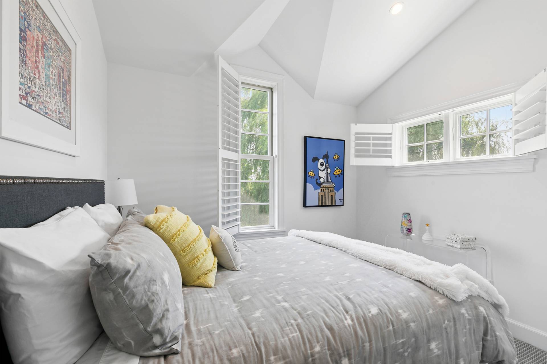 69 Shore Road Westhampton, NY 11977 - Photo 14 of 34 a bed sitting in a bedroom next to a window