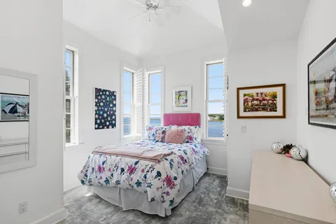 a bedroom with a bed and a table