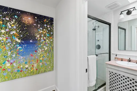 a bathroom with a shower curtain and a sink