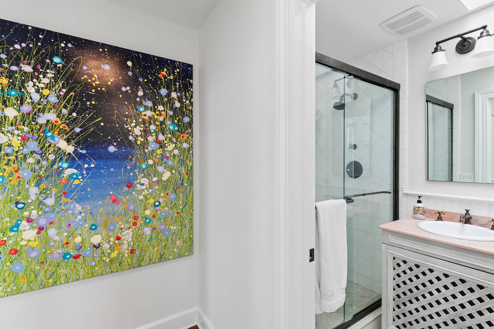 69 Shore Road Westhampton, NY 11977 - Photo 19 of 34 a bathroom with a shower curtain and a sink