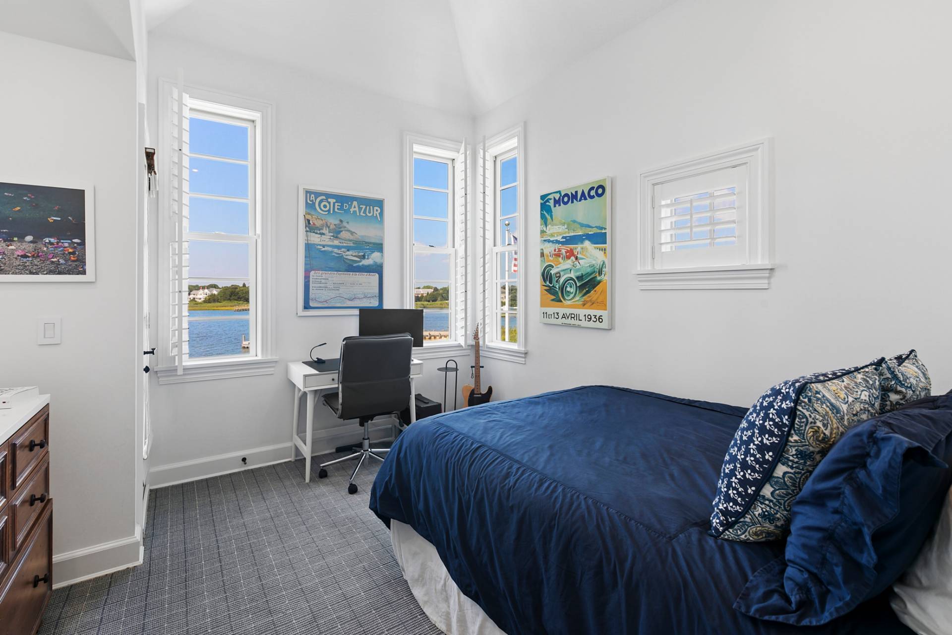 69 Shore Road Westhampton, NY 11977 - Photo 20 of 34 a bedroom with a bed and a table in it