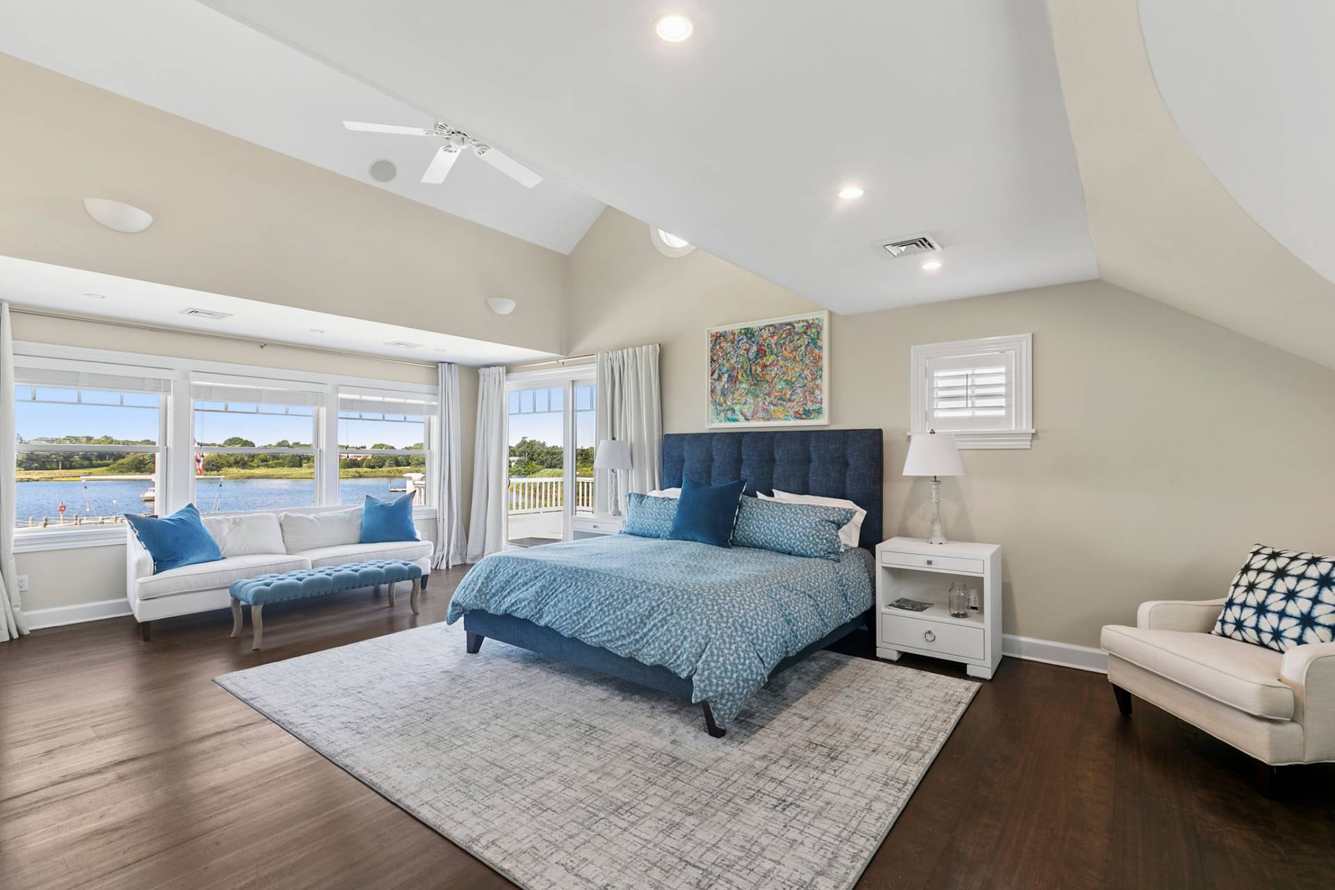 69 Shore Road Westhampton, NY 11977 - Photo 21 of 34 a bedroom with a bed and wooden floor