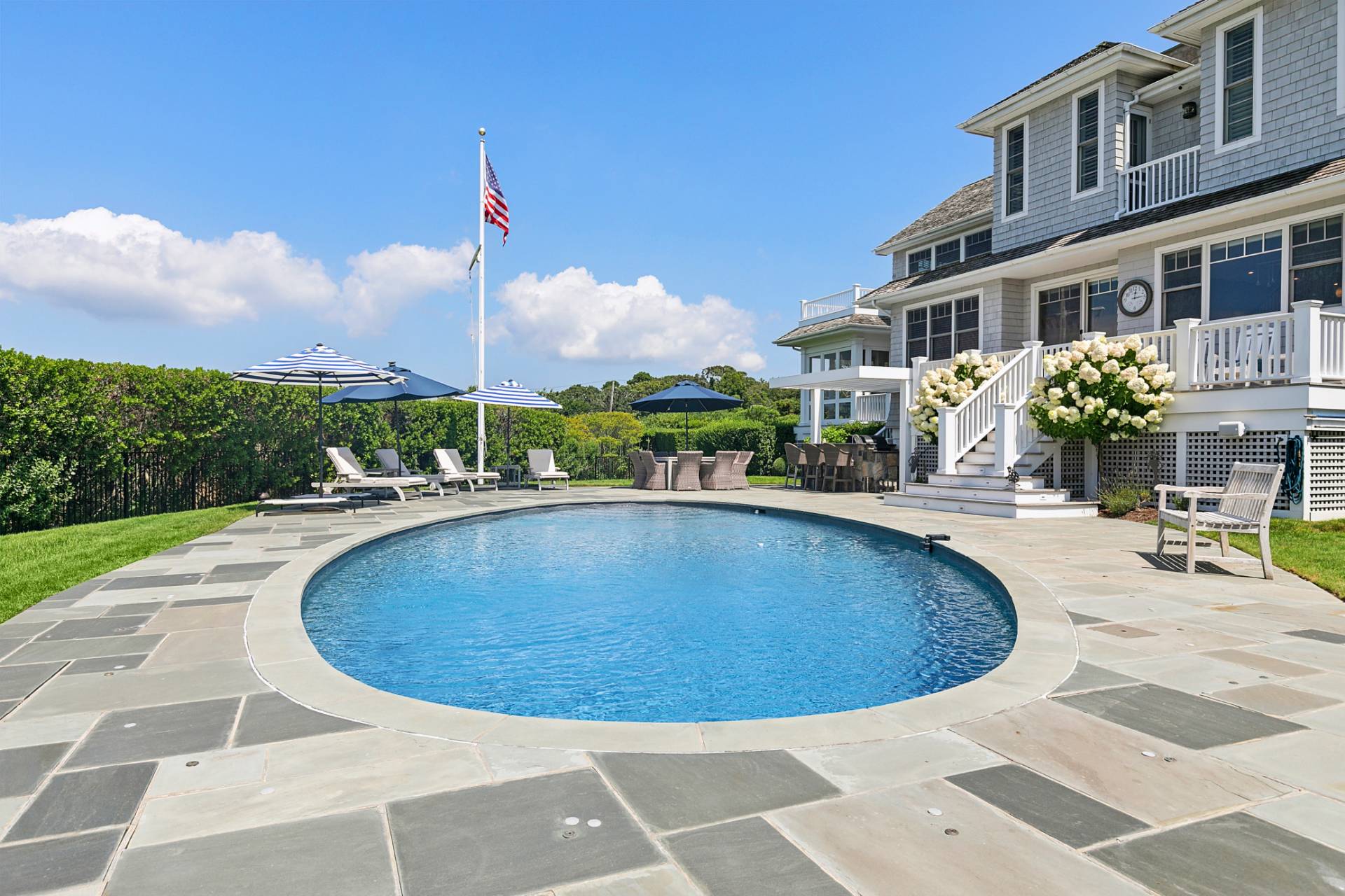 69 Shore Road Westhampton, NY 11977 - Photo 26 of 34 a view of a swimming pool with a patio