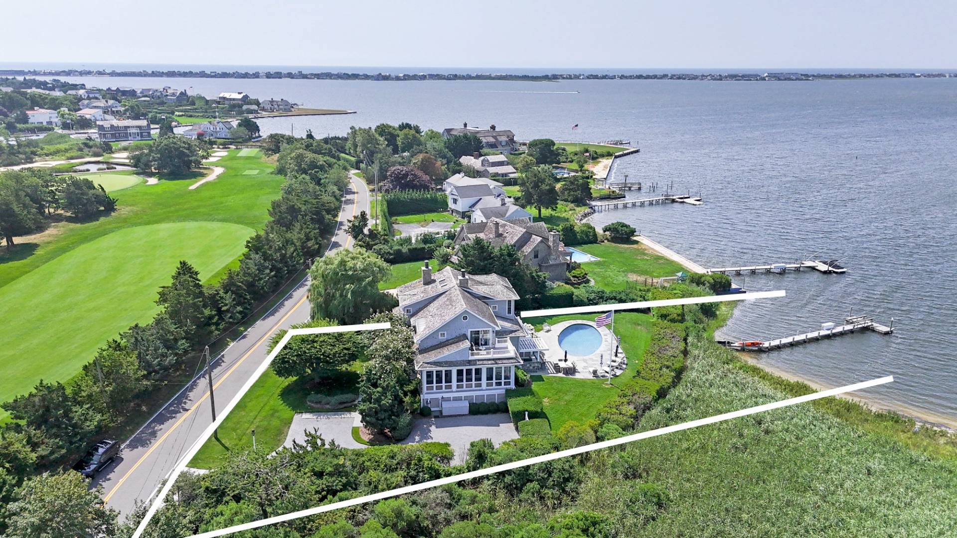 69 Shore Road Westhampton, NY 11977 - Photo 32 of 34 an aerial view of house with yard swimming pool and outdoor seating