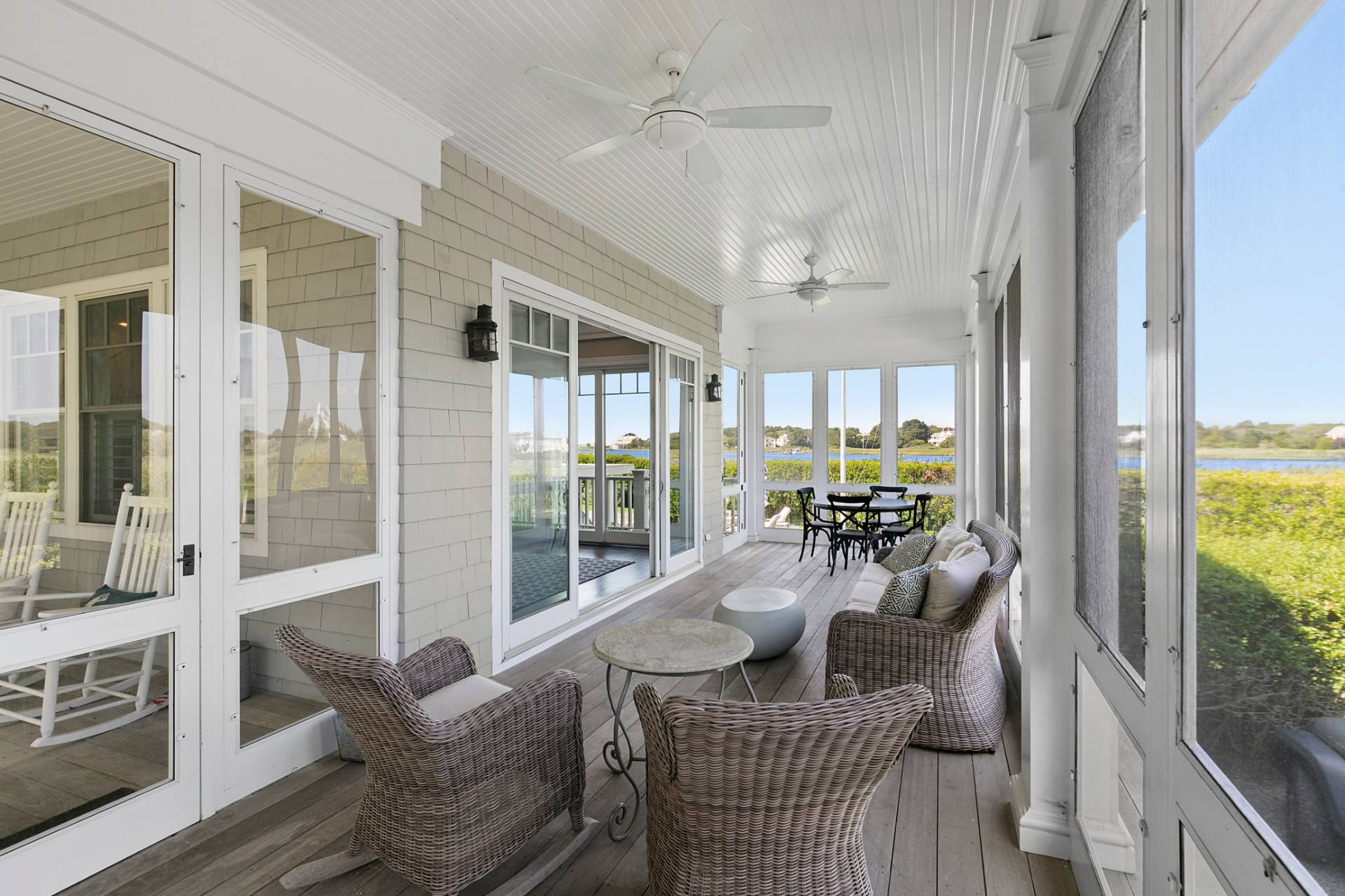 69 Shore Road Westhampton, NY 11977 - Photo 7 of 34 a living room with furniture and a large window