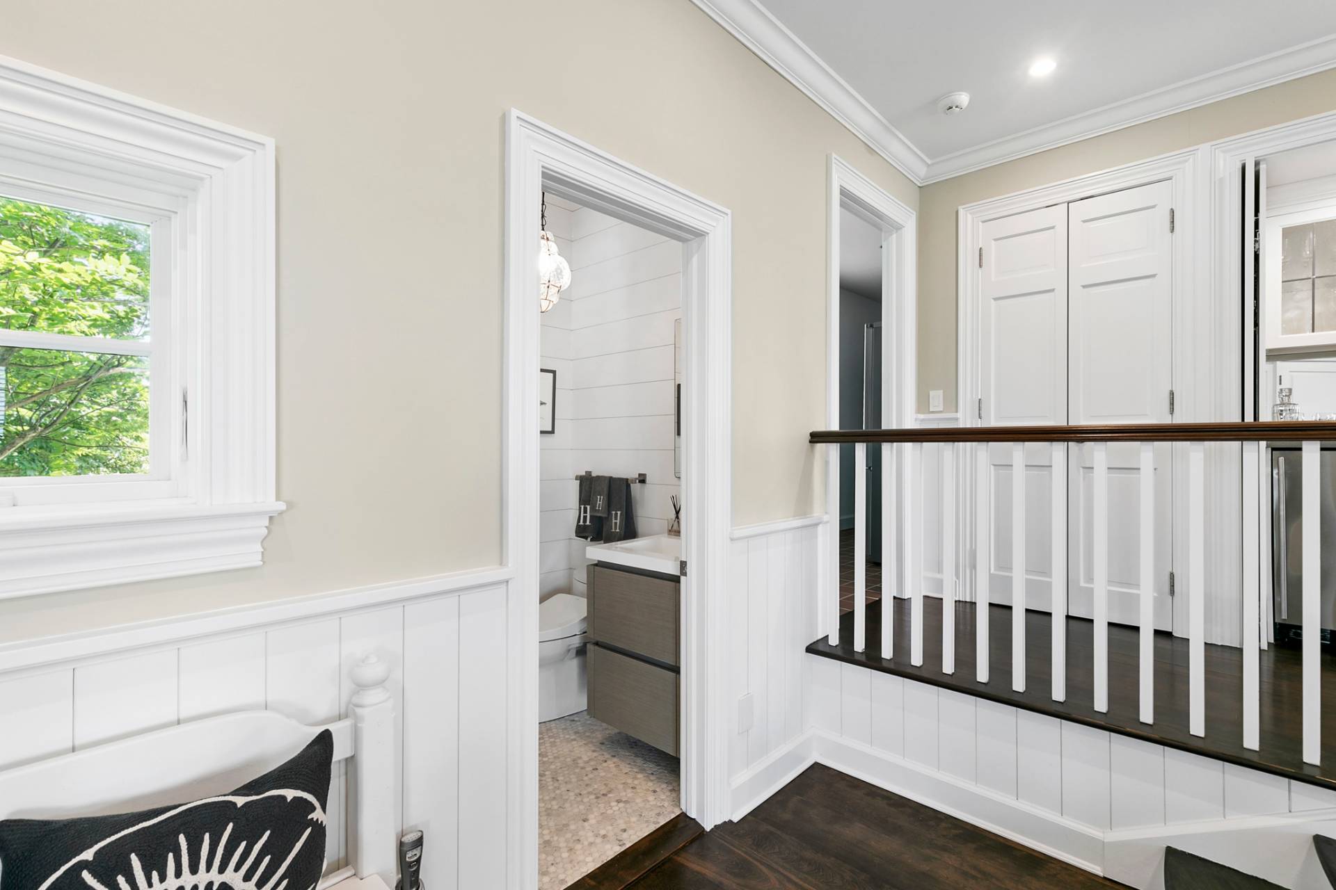 69 Shore Road Westhampton, NY 11977 - Photo 10 of 34 a view of a hallway with wooden floor and staircase