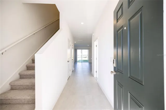 a kitchen with stainless steel appliances a refrigerator sink and stove