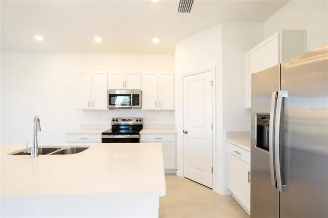 an empty room with sliding glass door