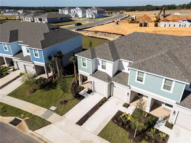 a view of a house with a tree