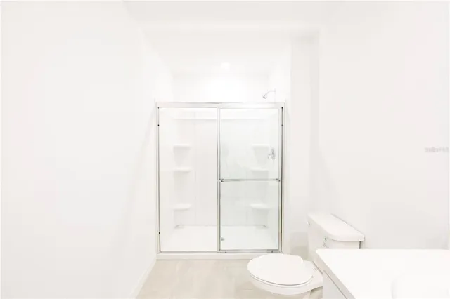 a view of a house with a swimming pool with a yard and plants