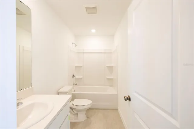 a view of a house with swimming pool and a yard