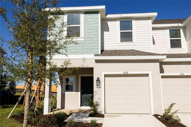 a front view of a house with a garage