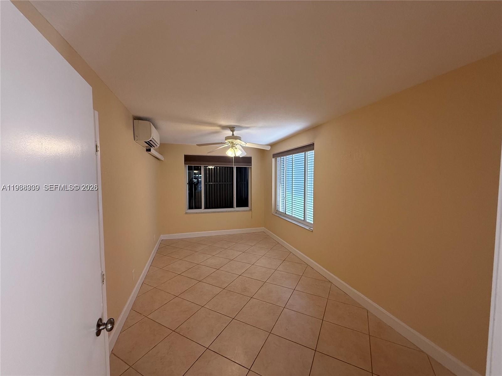 2271 Southwest 30th Terrace Fort Lauderdale, FL 33312 - Photo 23 of 40 a view of hallway with a window and chandelier