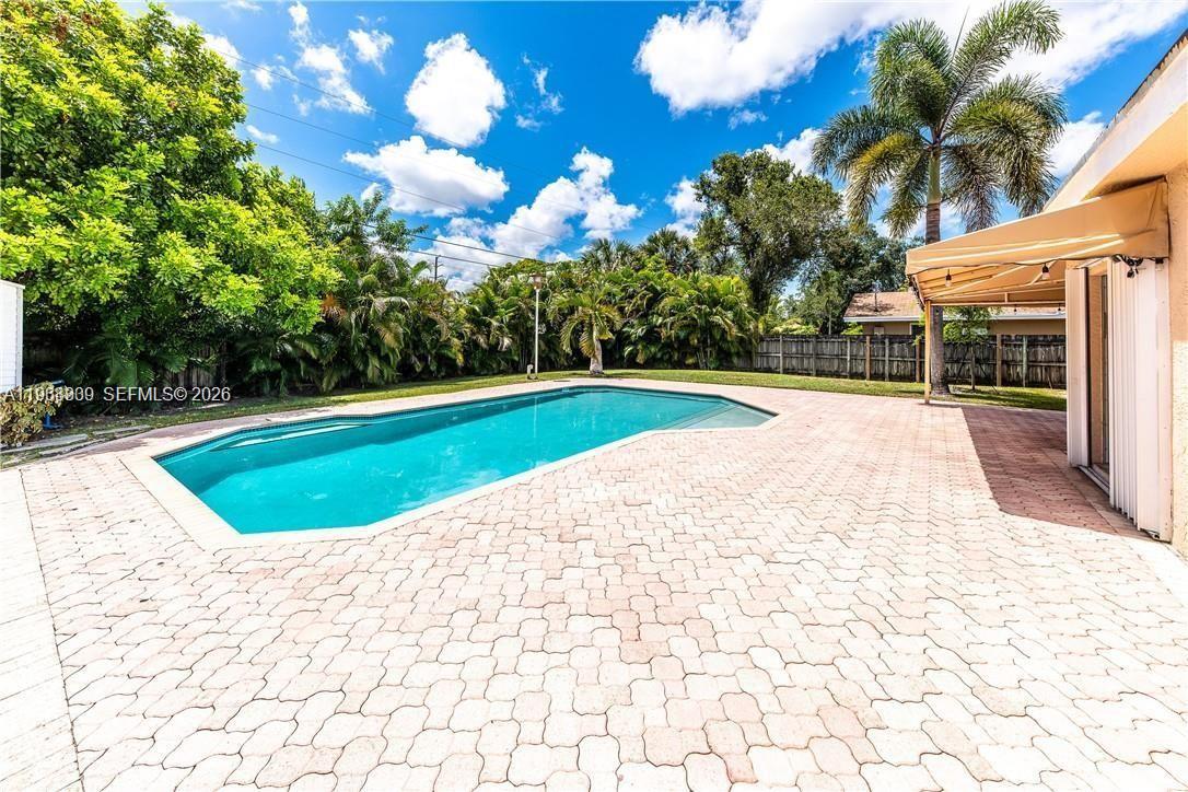 2271 Southwest 30th Terrace Fort Lauderdale, FL 33312 - Photo 3 of 40 a view of swimming pool with a yard