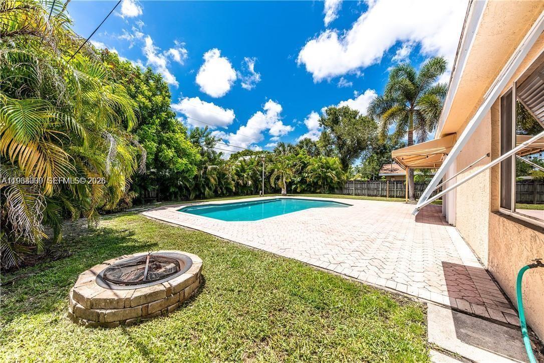2271 Southwest 30th Terrace Fort Lauderdale, FL 33312 - Photo 4 of 40 a view of a backyard with swimming pool
