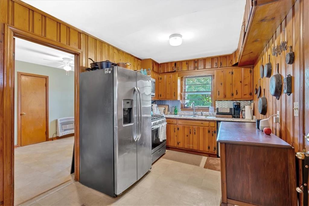 7783 Cantrell Road Douglasville, GA 30135 - Photo 11 of 38 a kitchen with stainless steel appliances a refrigerator and a stove