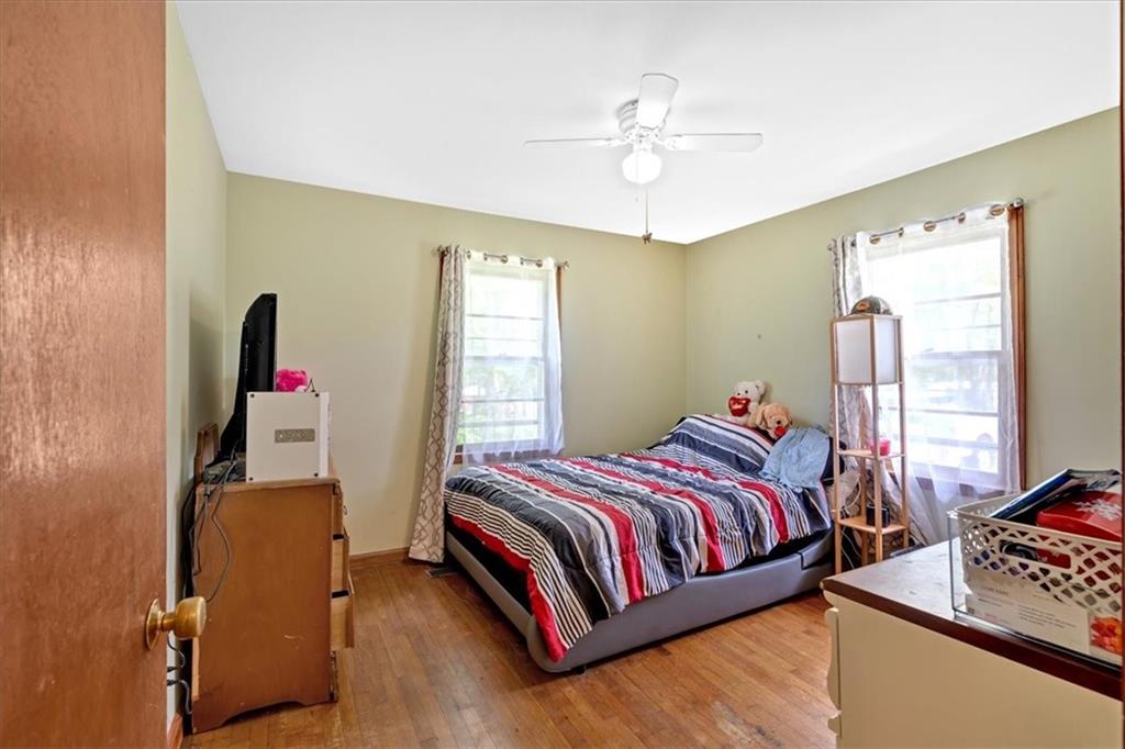7783 Cantrell Road Douglasville, GA 30135 - Photo 21 of 38 a bedroom with a bed and a window