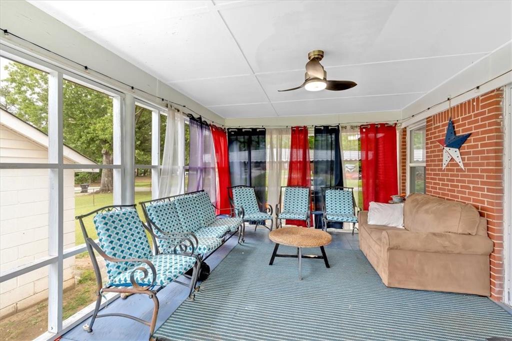 7783 Cantrell Road Douglasville, GA 30135 - Photo 23 of 38 a living room with furniture and a large window