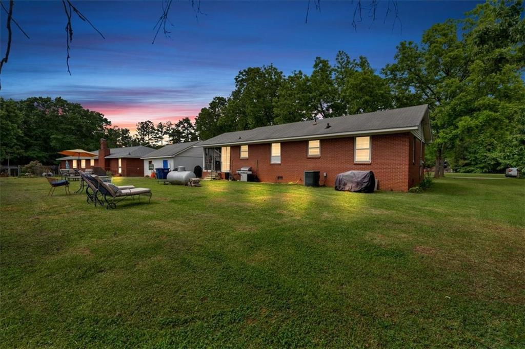 7783 Cantrell Road Douglasville, GA 30135 - Photo 25 of 38 a view of a house with a yard