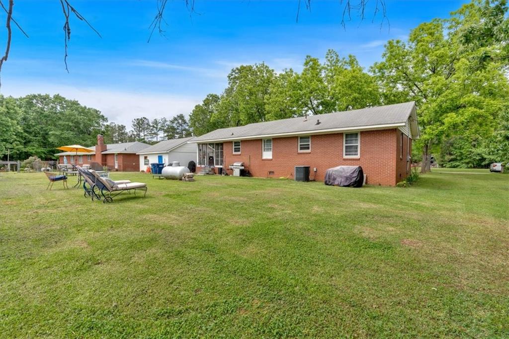 7783 Cantrell Road Douglasville, GA 30135 - Photo 27 of 38 a front view of house with yard and seating area
