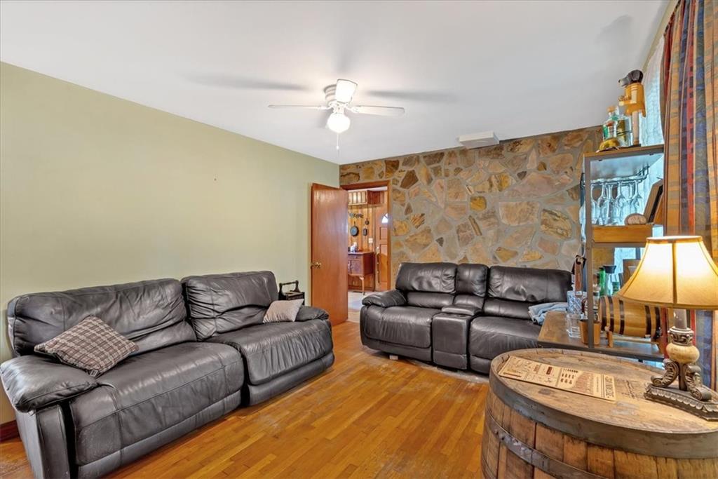7783 Cantrell Road Douglasville, GA 30135 - Photo 10 of 38 a living room with furniture and a chandelier