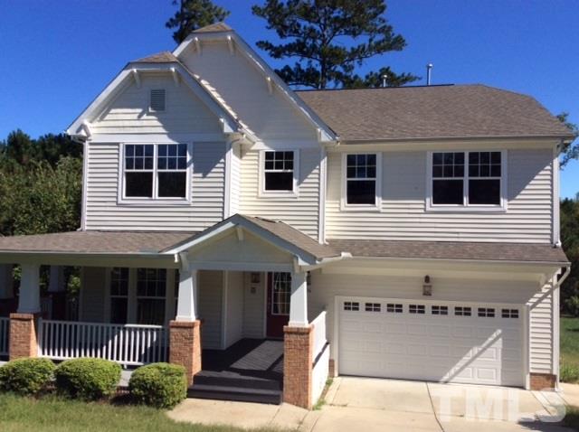 136 Locke Woods Road Raleigh, NC 27603 - Photo 1 of 18 a front view of a house with a yard