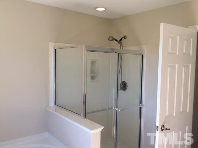 136 Locke Woods Road Raleigh, NC 27603 - Photo 13 of 18 a bathroom with a shower