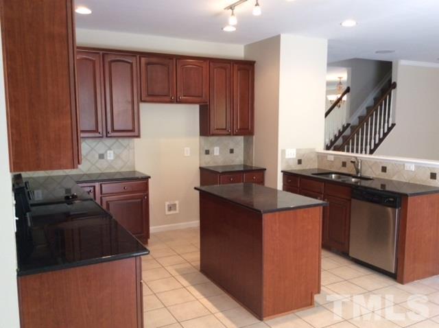 136 Locke Woods Road Raleigh, NC 27603 - Photo 6 of 18 a kitchen with stainless steel appliances granite countertop a stove a refrigerator and a refrigerator