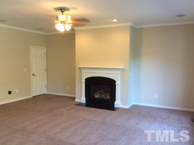 136 Locke Woods Road Raleigh, NC 27603 - Photo 8 of 18 a view of a livingroom with a fireplace