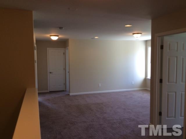 136 Locke Woods Road Raleigh, NC 27603 - Photo 10 of 18 a view of hallway with a bathroom