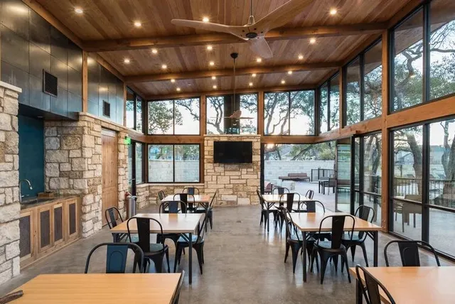 a outdoor living space with furniture and a fireplace