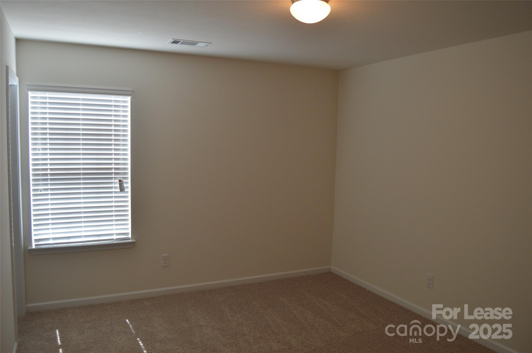 117 Quail Springs Road Statesville, NC 28677 - Photo 11 of 22 an empty room with a window