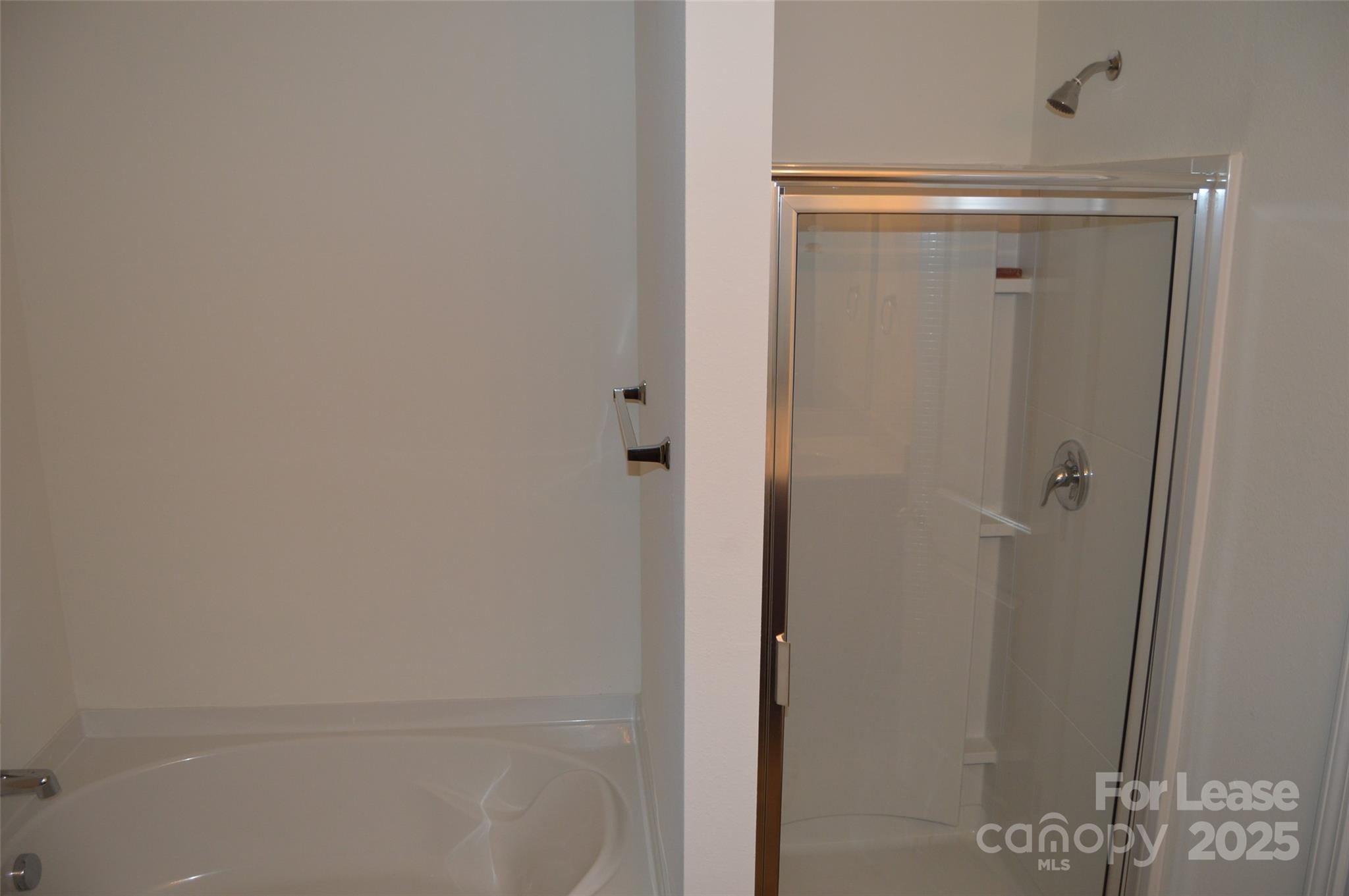 117 Quail Springs Road Statesville, NC 28677 - Photo 16 of 22 a bathroom with a glass shower door