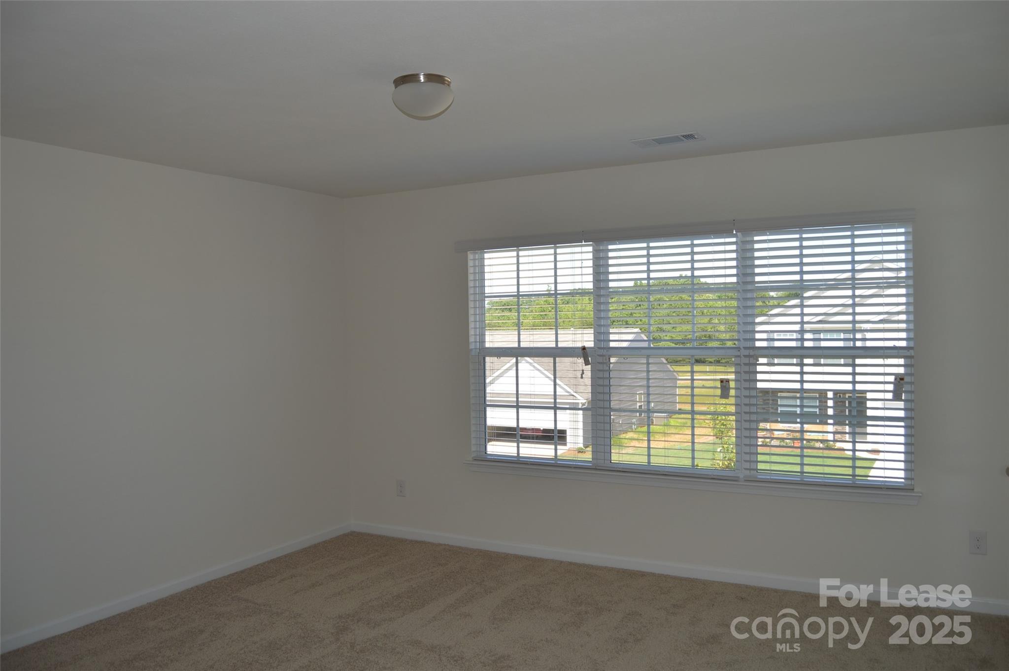117 Quail Springs Road Statesville, NC 28677 - Photo 3 of 22 a view of an empty room with a window