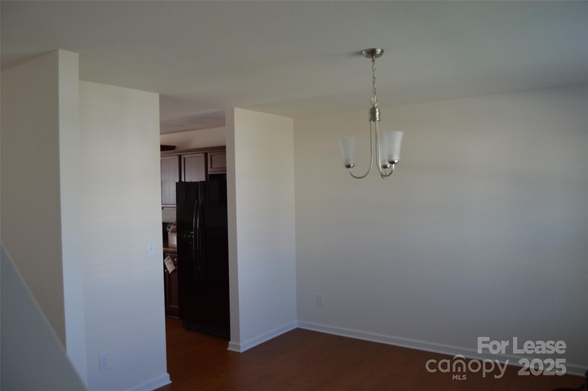 117 Quail Springs Road Statesville, NC 28677 - Photo 4 of 22 a view of a room with walk in closet and wooden floor