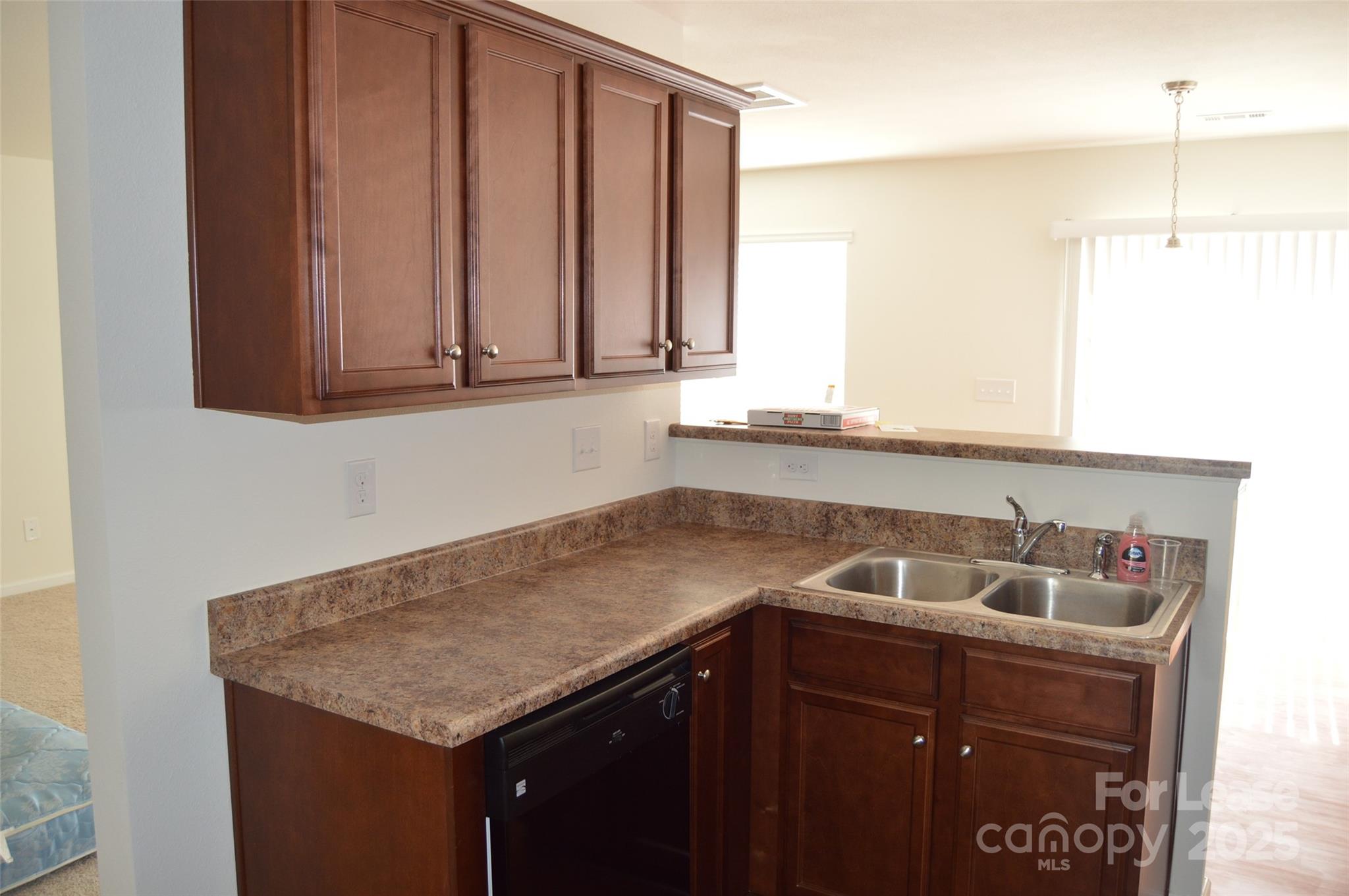 117 Quail Springs Road Statesville, NC 28677 - Photo 5 of 22 a kitchen with a sink and cabinets