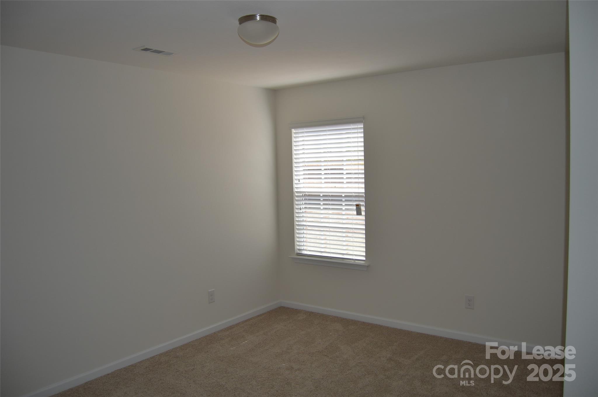 117 Quail Springs Road Statesville, NC 28677 - Photo 9 of 22 a view of an empty room with a window
