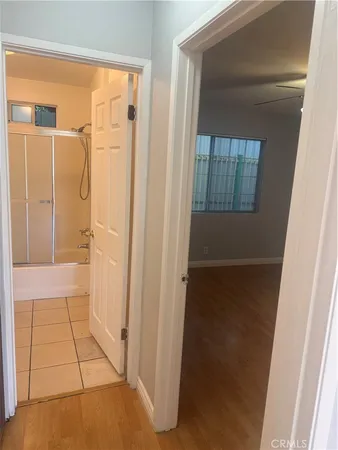 a bathroom with a granite countertop toilet sink and mirror
