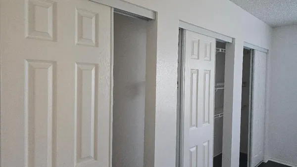 a view of a livingroom with a wooden door