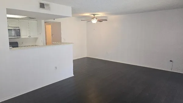 wooden floor in an empty room with a mirror